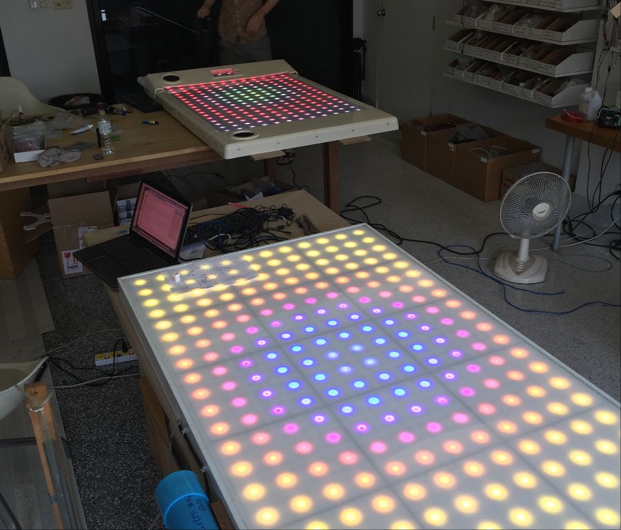 Working in the lab, two versions of product evolution.